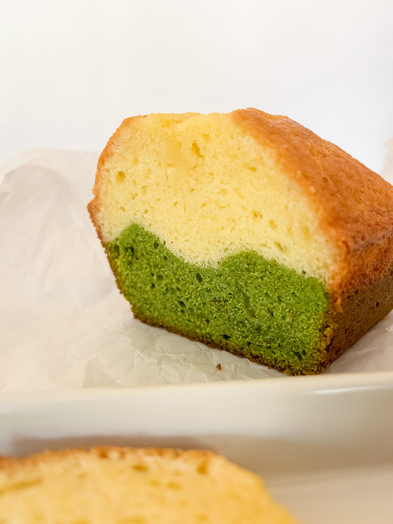 close up of marble matcha pound cake slices on white dish