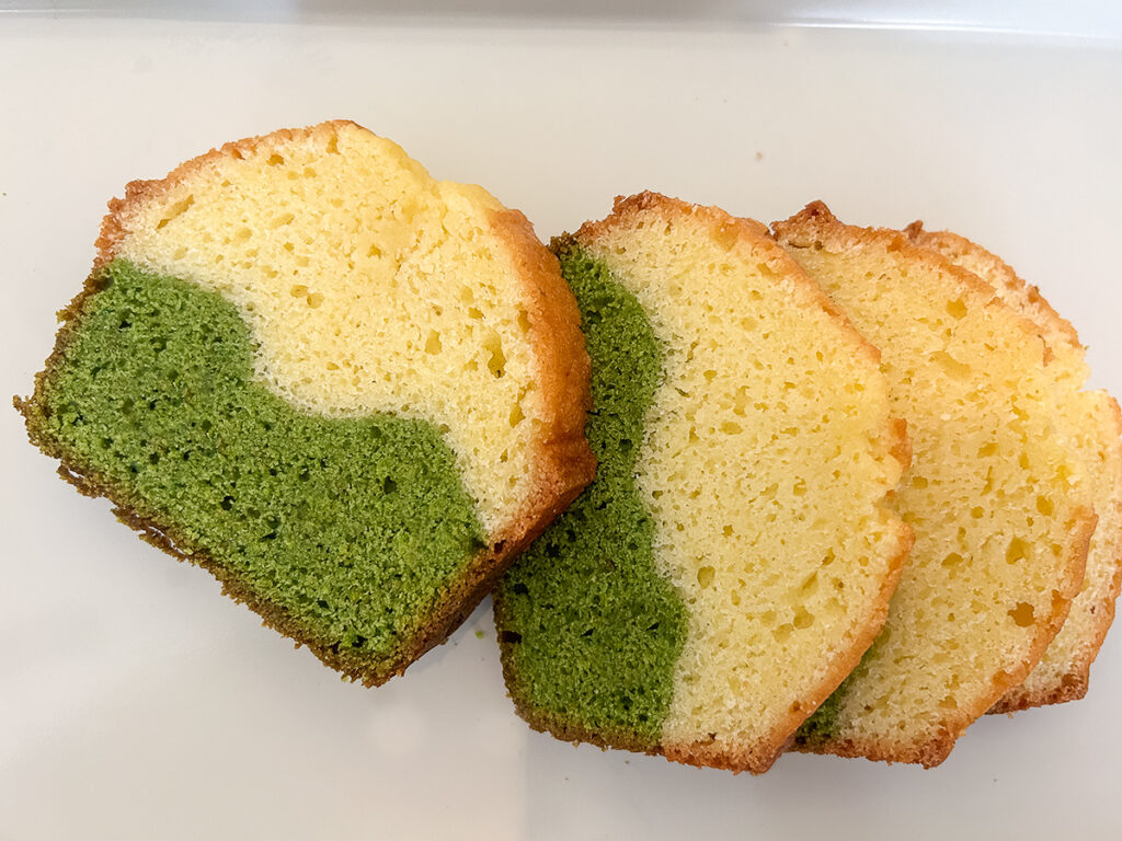 marble matcha pound cake slices laid out on white table