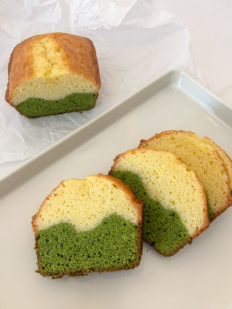 overhead view of marble matcha pound cake slices on white table