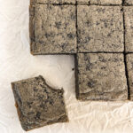 overhead view of a black sesame blondie with a bite taken out