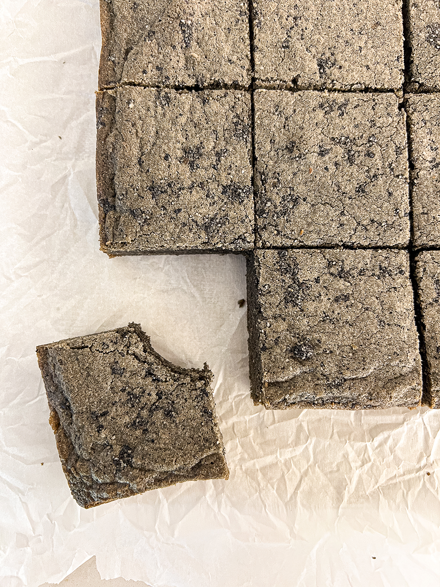 overhead view of a black sesame blondie with a bite taken out